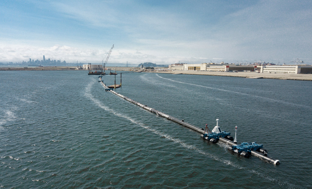 Ocean cleanup project giant floating rubber boom collector