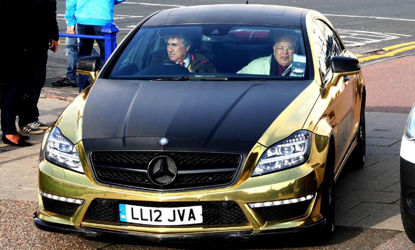Abid Gulzar and friend from India, riding in the gold wrapped Mercedex Benz