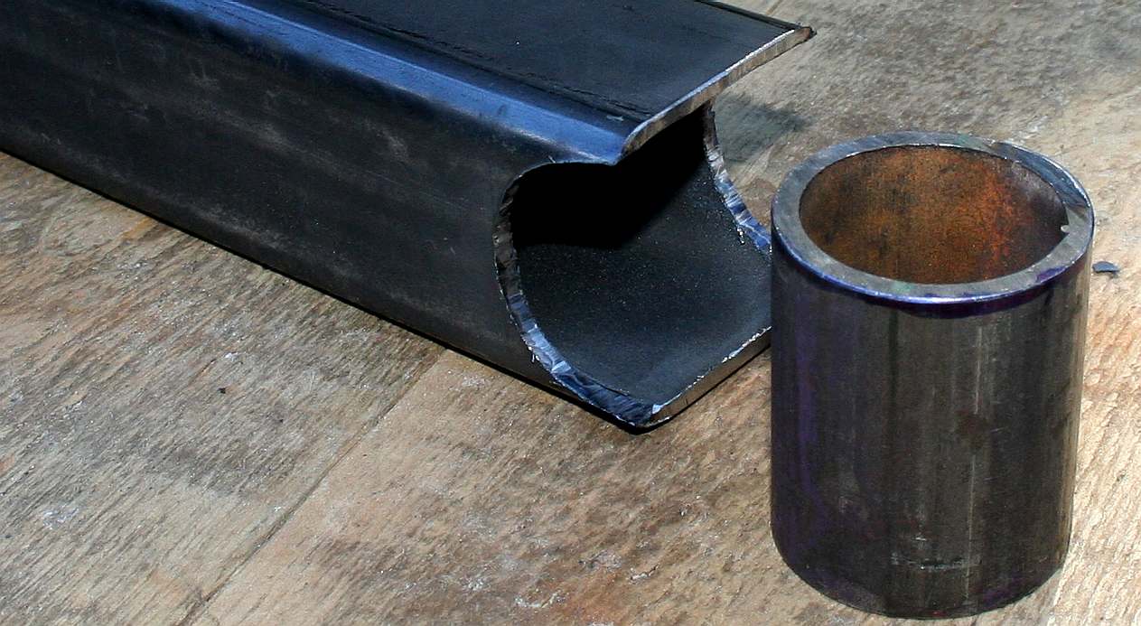 Steel post cut to accept a shell bearing.