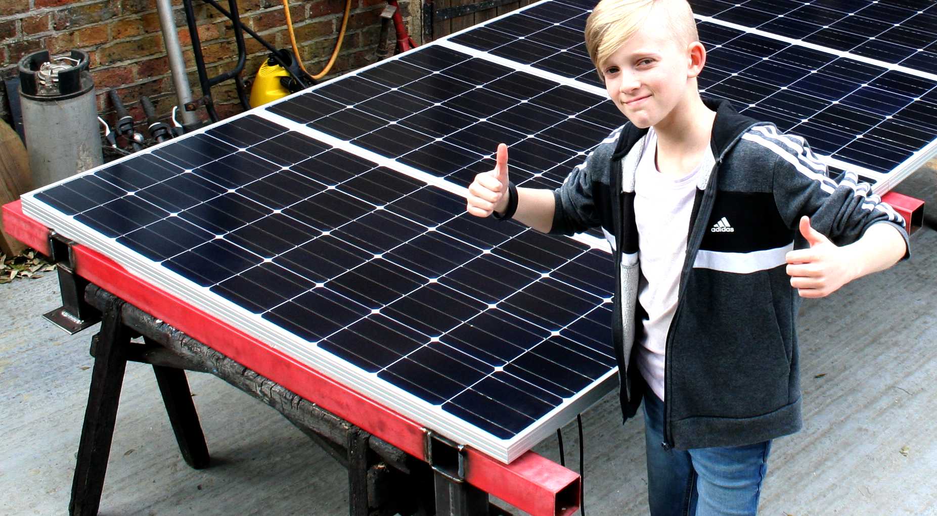 Ryan Dusart checks out these solar panels