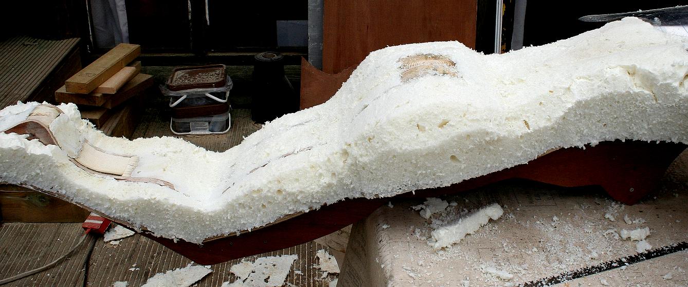 Rough cutting the polyurethane core foam to the bodywork